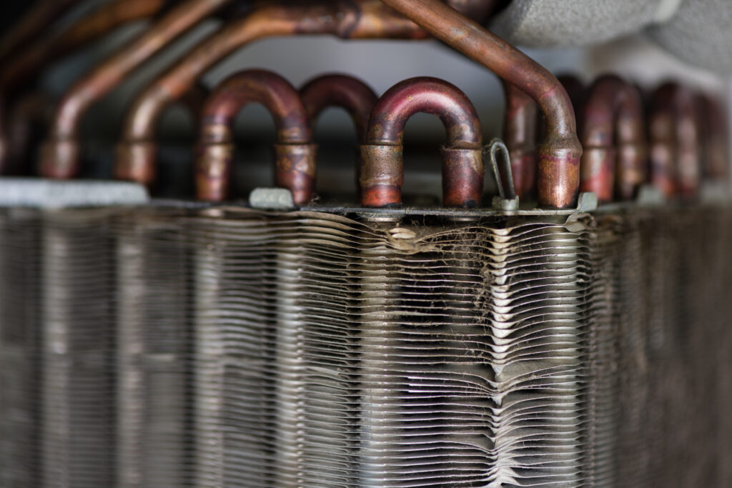 A close up picture of evaporator coils that are dirty and in need of maintenance