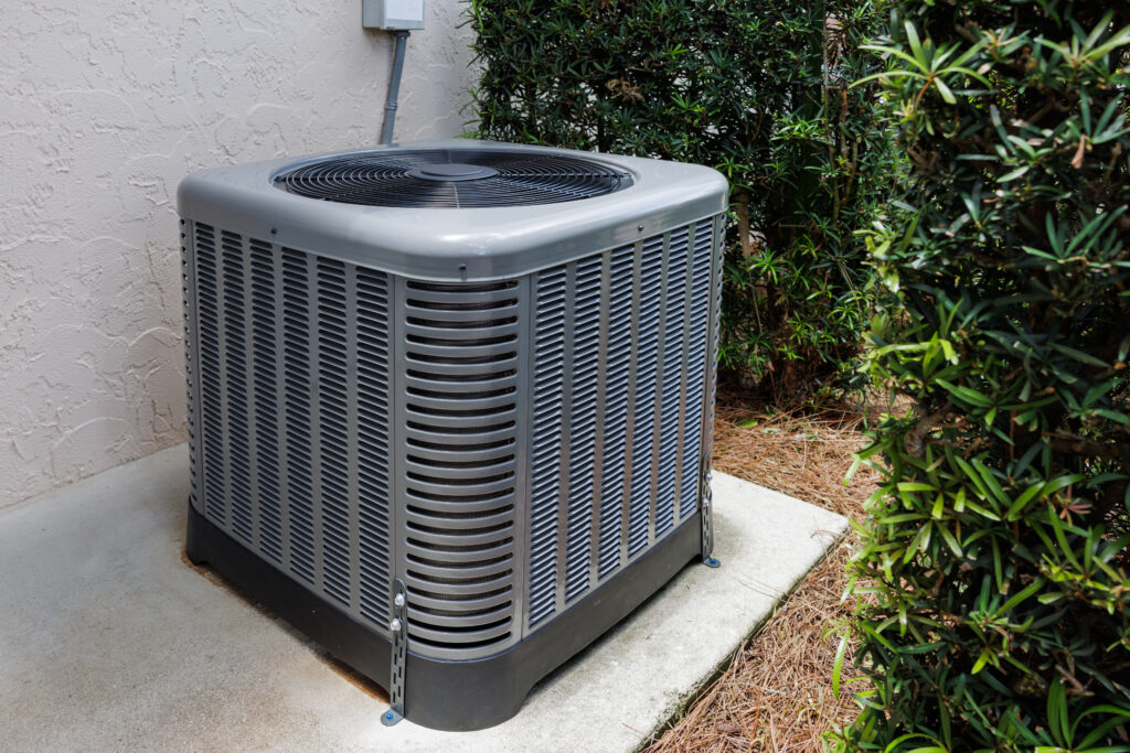 A picture of a clean outside air conditioning unit that has been well maintained