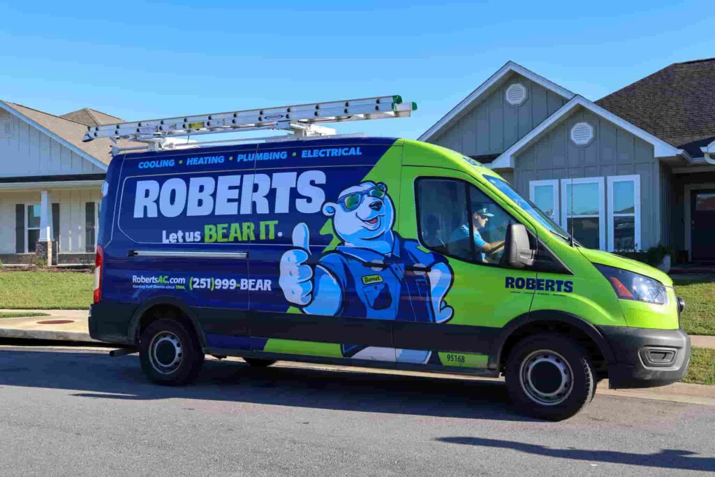A Robert's heating Contractors Truck in front of a home